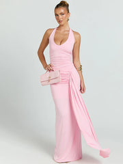 Woman wearing a pink evening gown with a white background
