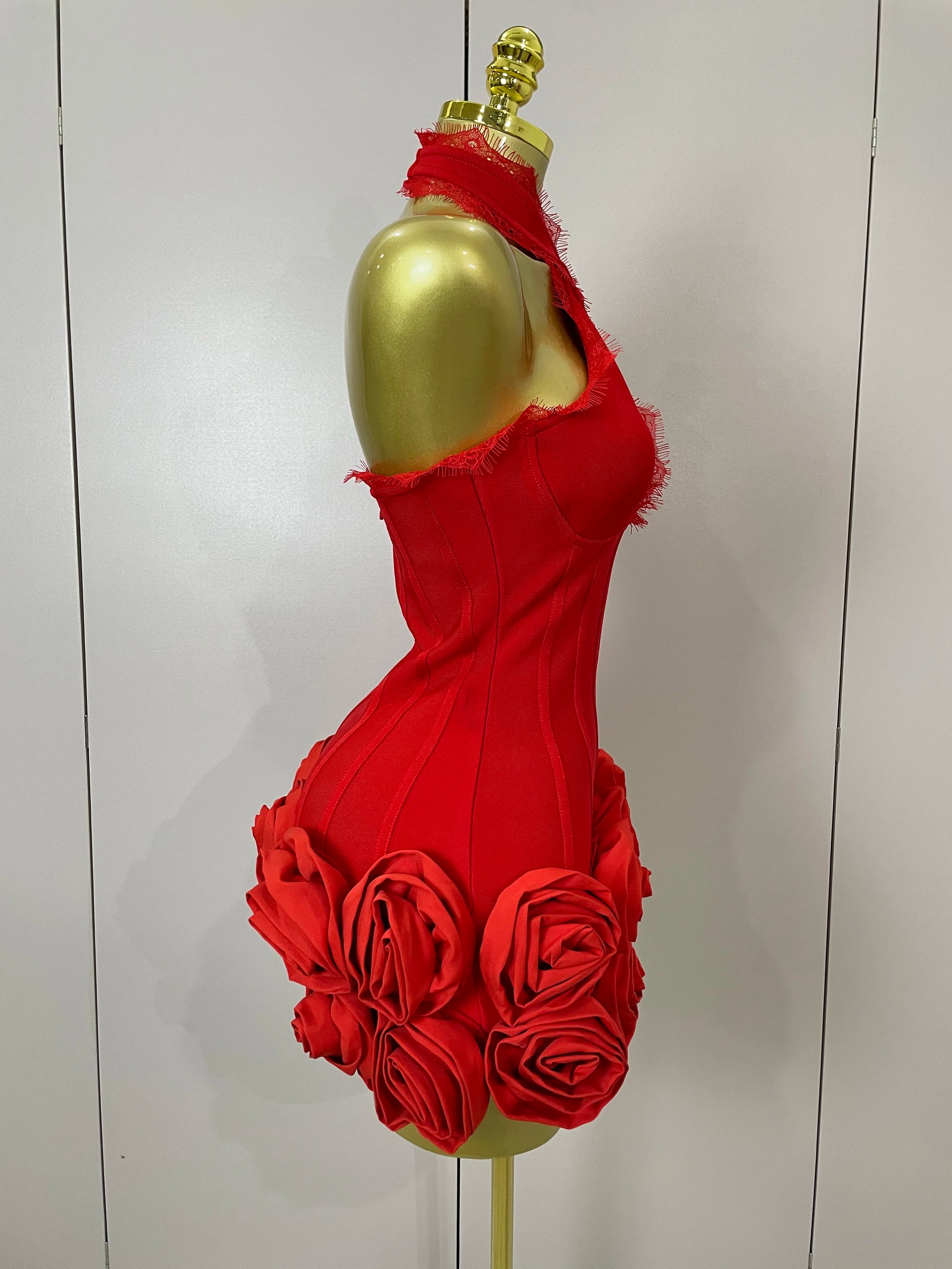 Red dress on a gold mannequin against a white background