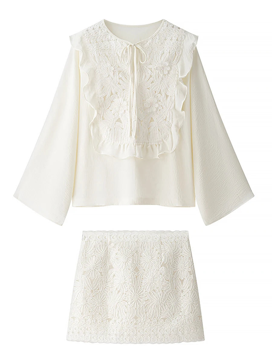 White lace top and skirt set on a white background