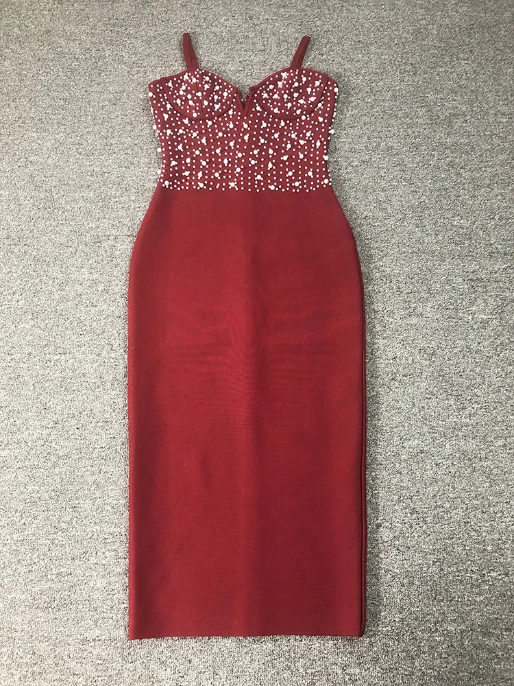 Red dress with a beaded top on a gray carpeted floor