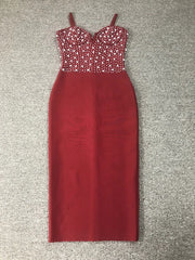 Red dress with a beaded top on a gray carpeted floor