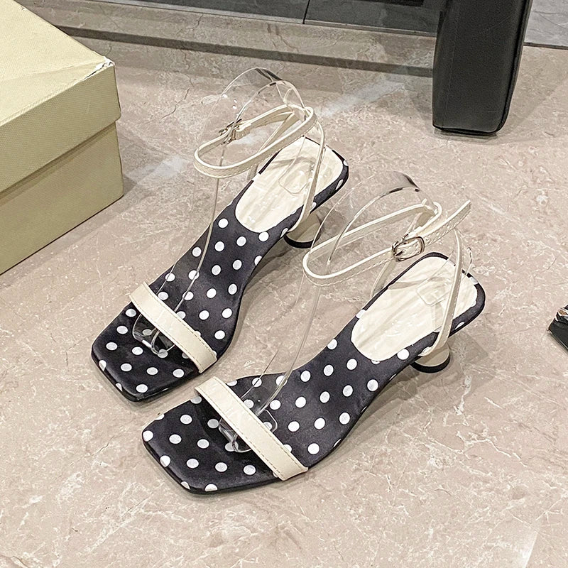 Close-up of polka dot ankle strap heel design