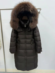 Long dark coat with fur hood on a rack
