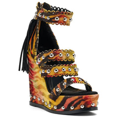 Close-up of tiger print wedge platform sandals with metallic studs