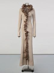 Beige dress with ruffled details on a mannequin against a white background