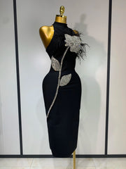 Turtleneck sleeveless diamond and feather embellished midi dress side view.