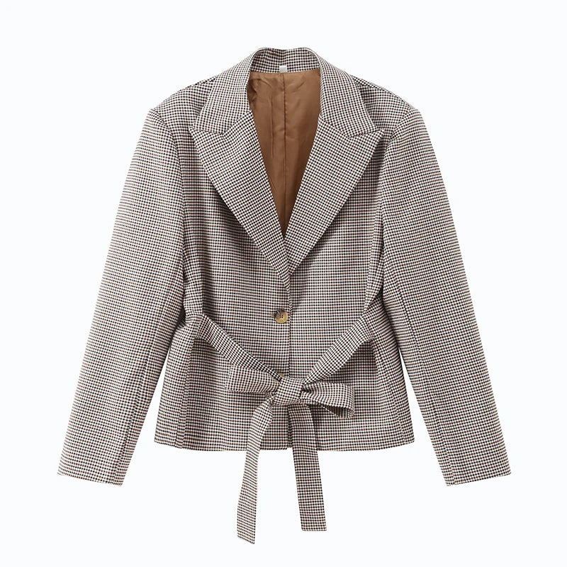 Houndstooth patterned jacket with a belt on a white background