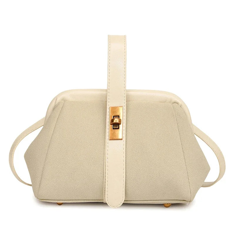 Beige handbag with a gold clasp on a white background