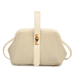 Beige handbag with a gold clasp on a white background