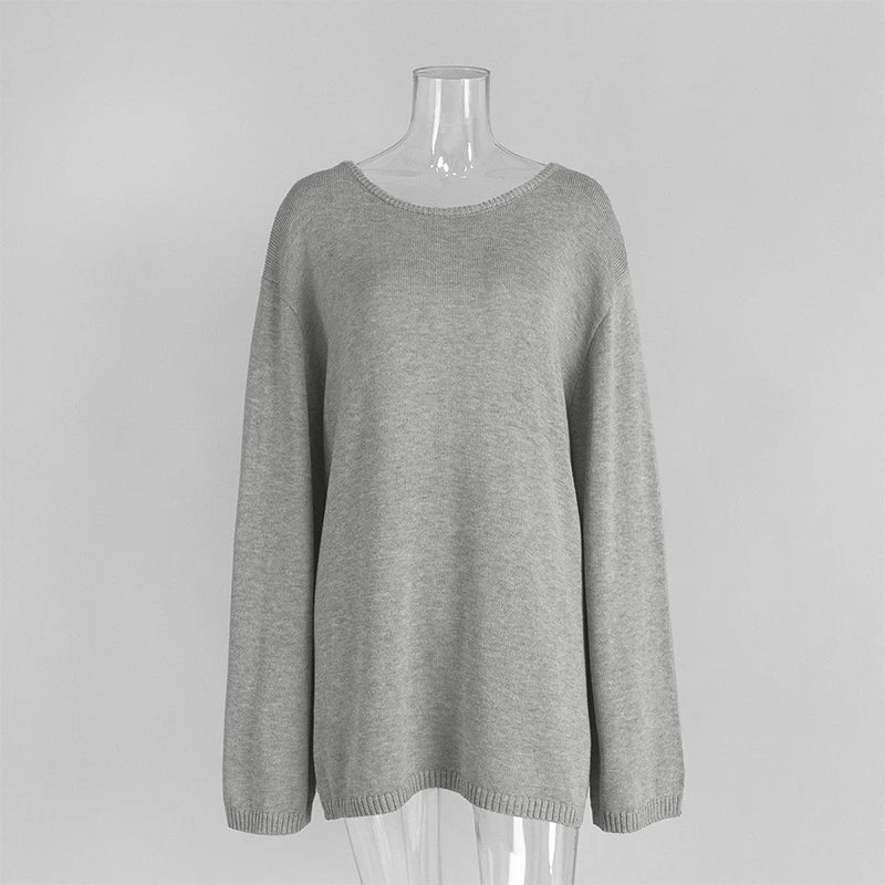 Gray sweater on a mannequin against a plain background