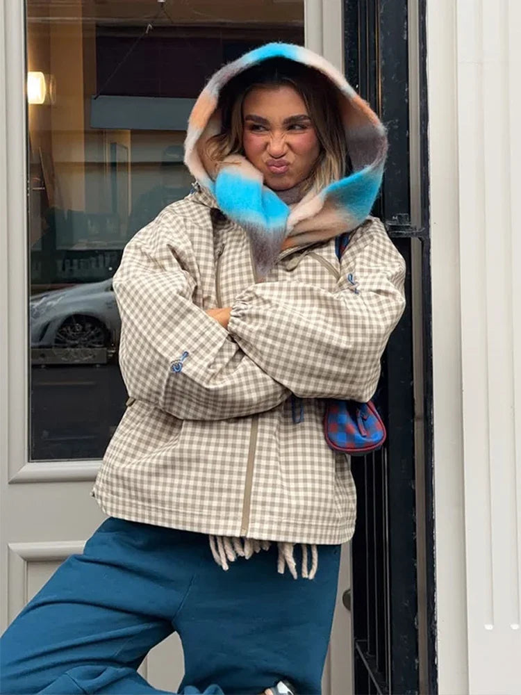 Model wearing gingham jacket with colorful hood accessory