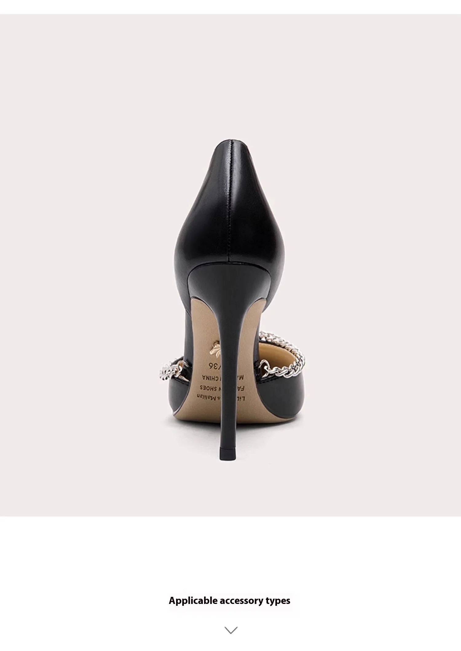 Black high-heeled shoe with decorative elements on a white background