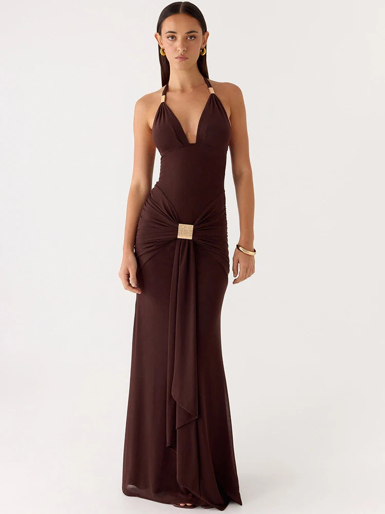 Woman wearing a brown evening gown on a white background