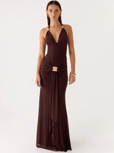 Woman wearing a brown evening gown on a white background