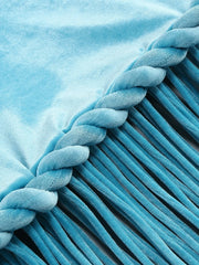 Close-up of a blue textured fabric with braided edge
