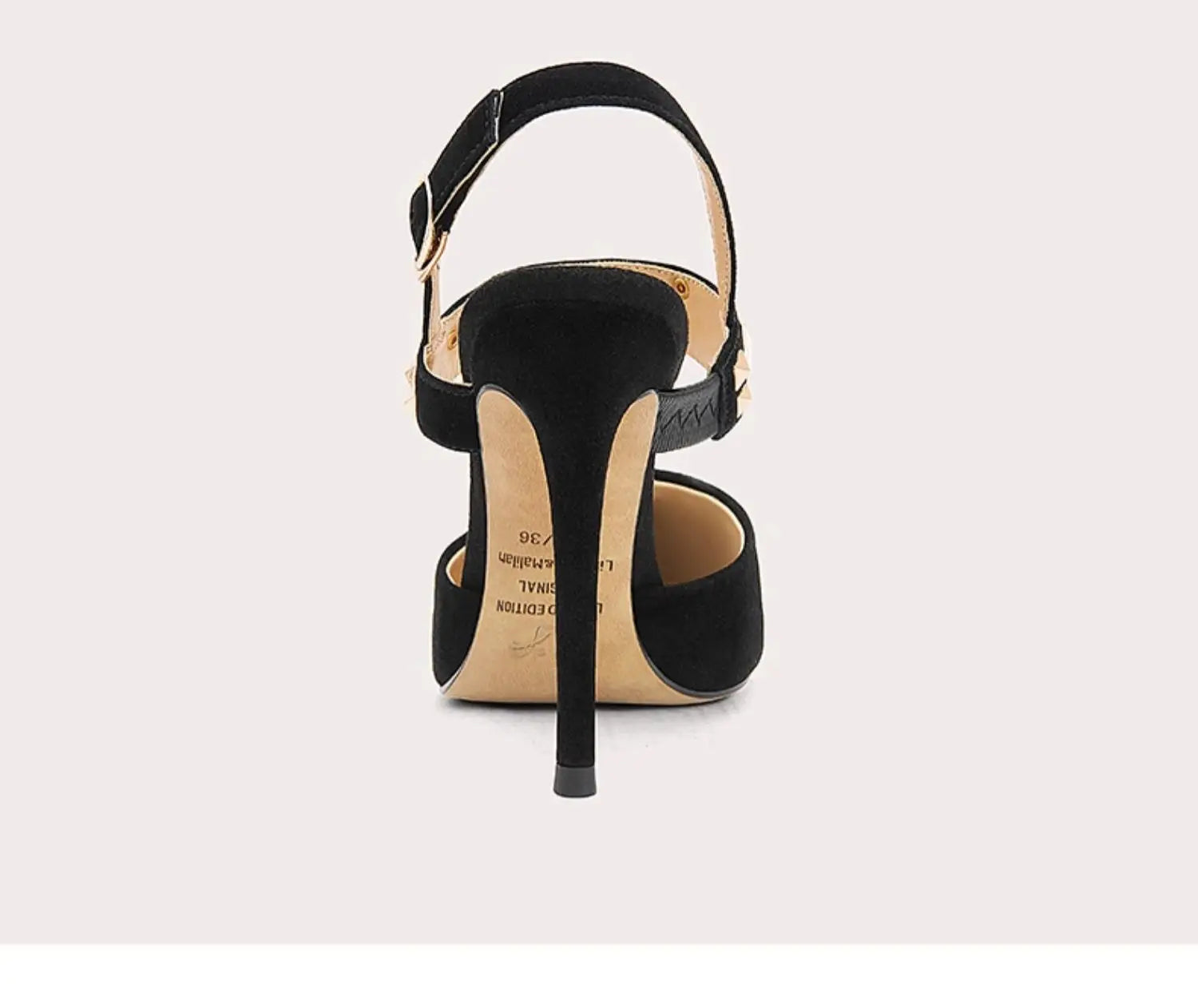 Black high-heeled sandal on a light gray background