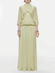 Green chiffon maxi dress with cape sleeves and jewel buckle
