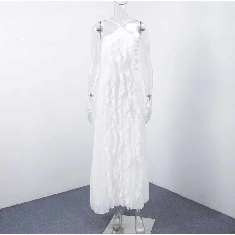 White dress with feather details on a mannequin against a plain background