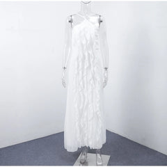 White dress with feather details on a mannequin against a plain background