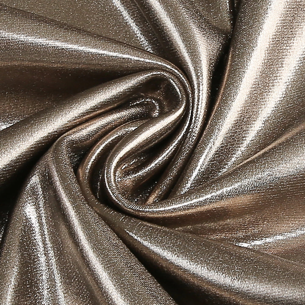Close-up of metallic fabric with a swirling pattern