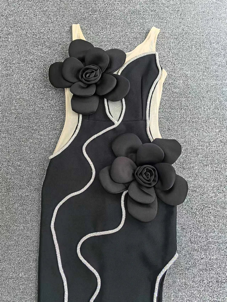 Black swimsuit with floral designs on a gray background