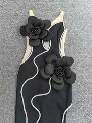 Black swimsuit with floral designs on a gray background
