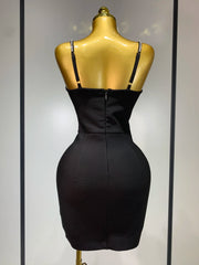 Black dress on a mannequin against a neutral background