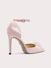 Pink high-heeled shoe on a light gray background