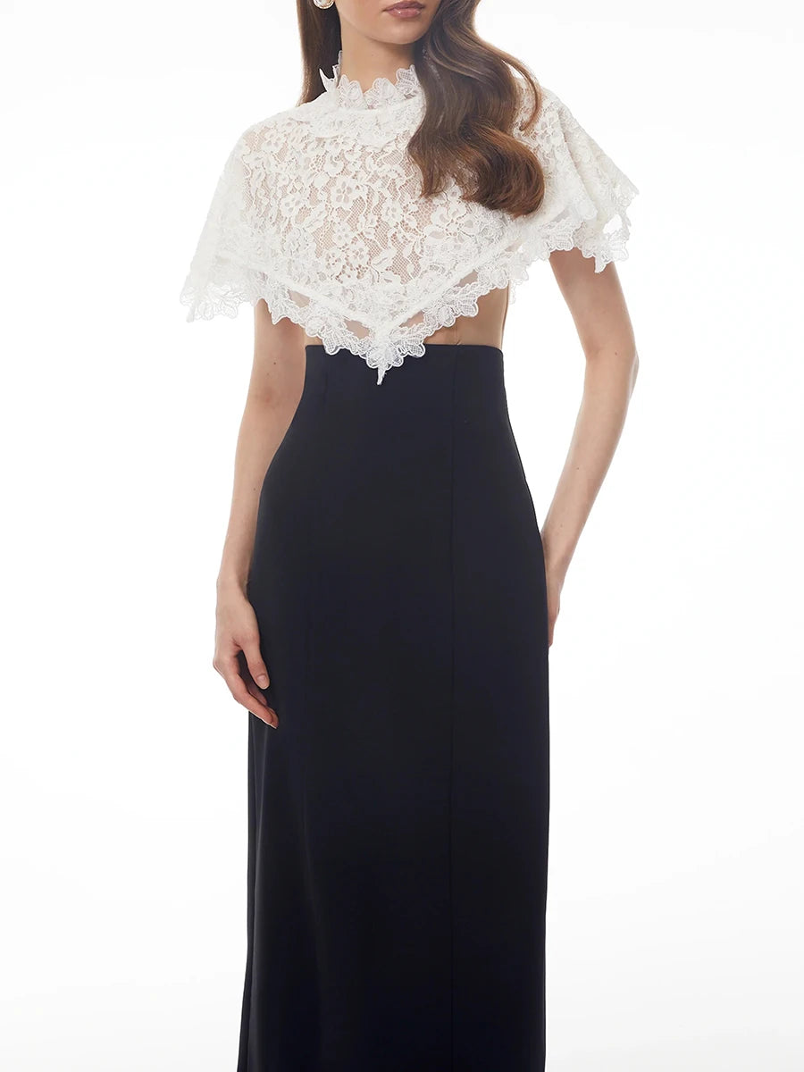 Sheath dress with a white lace cape overlay, front view.