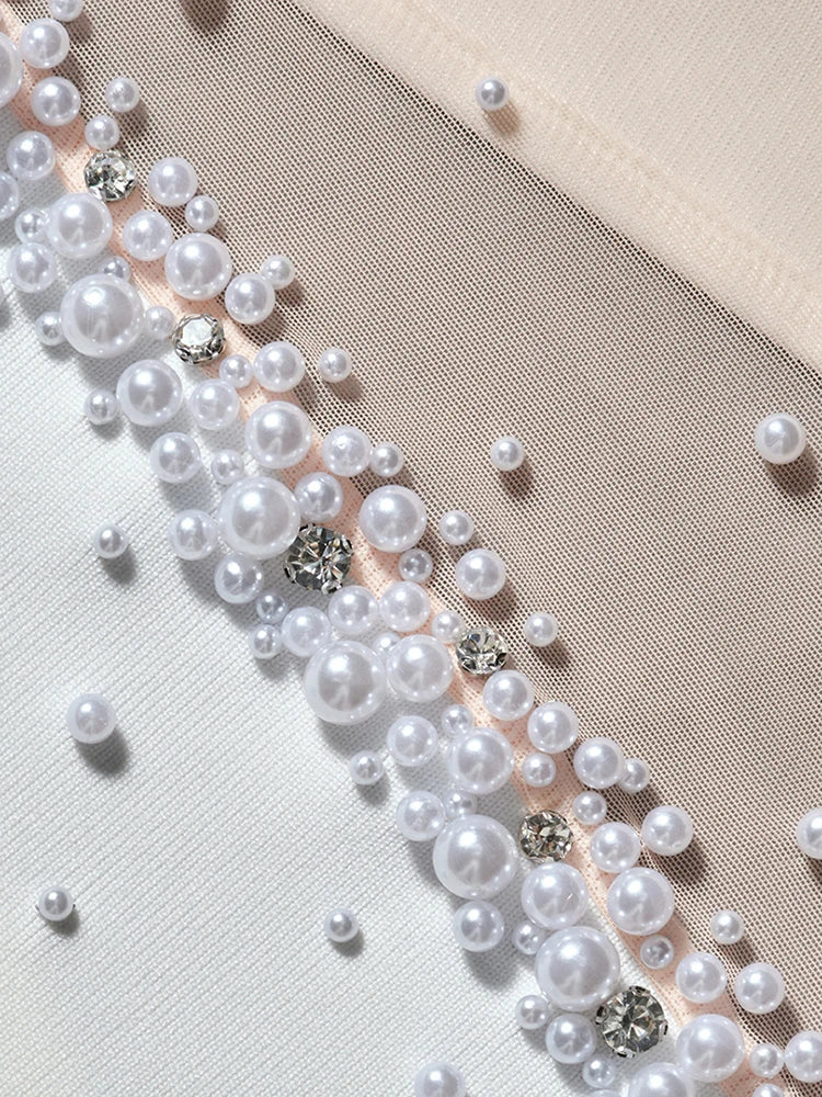 Pearl and crystal trim on a fabric background
