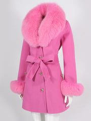 Pink coat with fur collar and cuffs on a white background