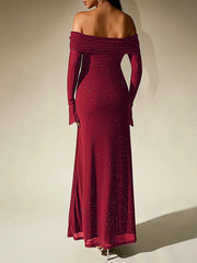 Red off-shoulder evening gown with long sleeves on a plain background