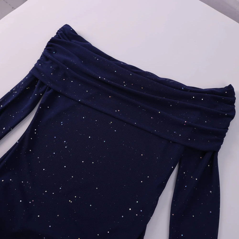 Navy blue fabric with small white dots on a white background