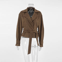 Brown suede jacket on a mannequin against a white background