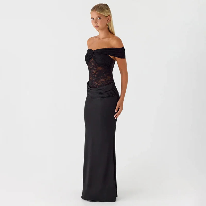 Woman wearing a black off-shoulder evening gown on a white background