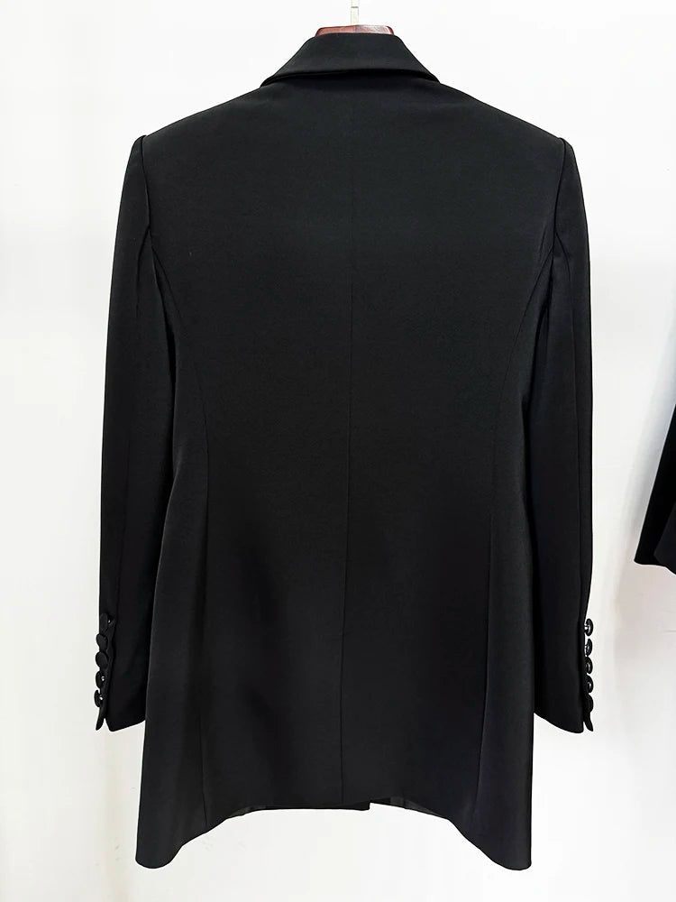 Back view of a black double-breasted blazer with embellished lapels