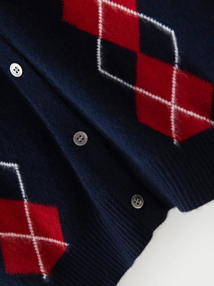 Navy cardigan with red and white checkered pattern on a white background