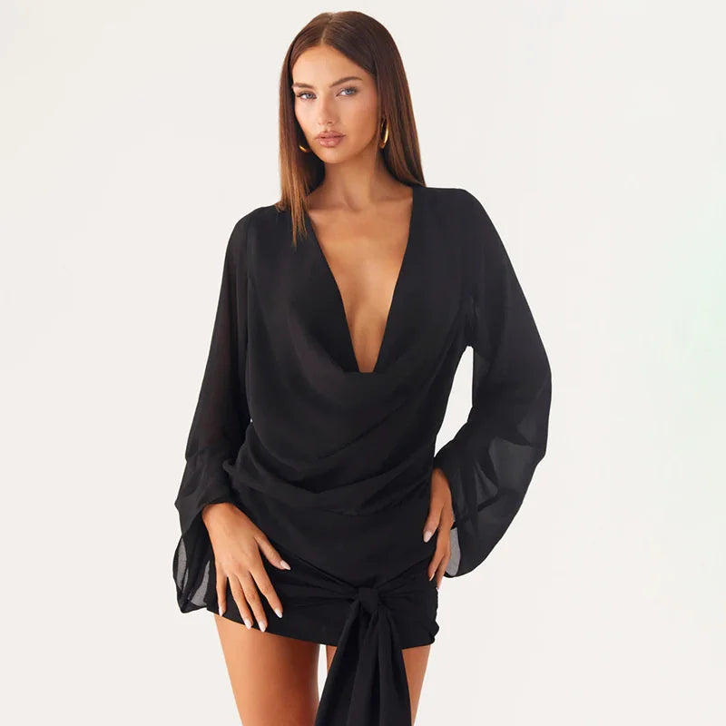 Woman wearing a black outfit with long sleeves