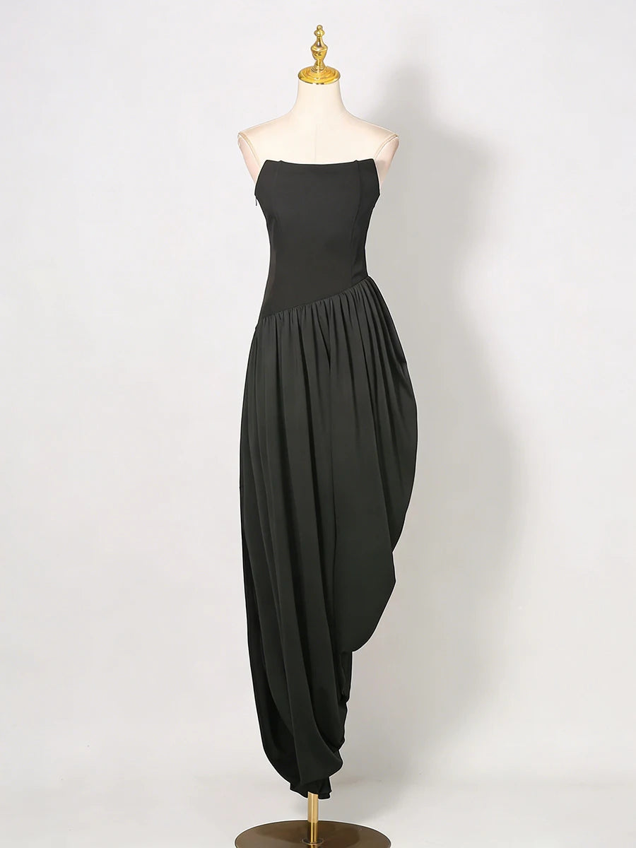 Black strapless dress on a mannequin against a white background