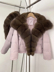 Pink puffer jacket with brown fur collar on a hanger against a white background