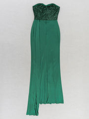 Green strapless dress with sequined top on a white background