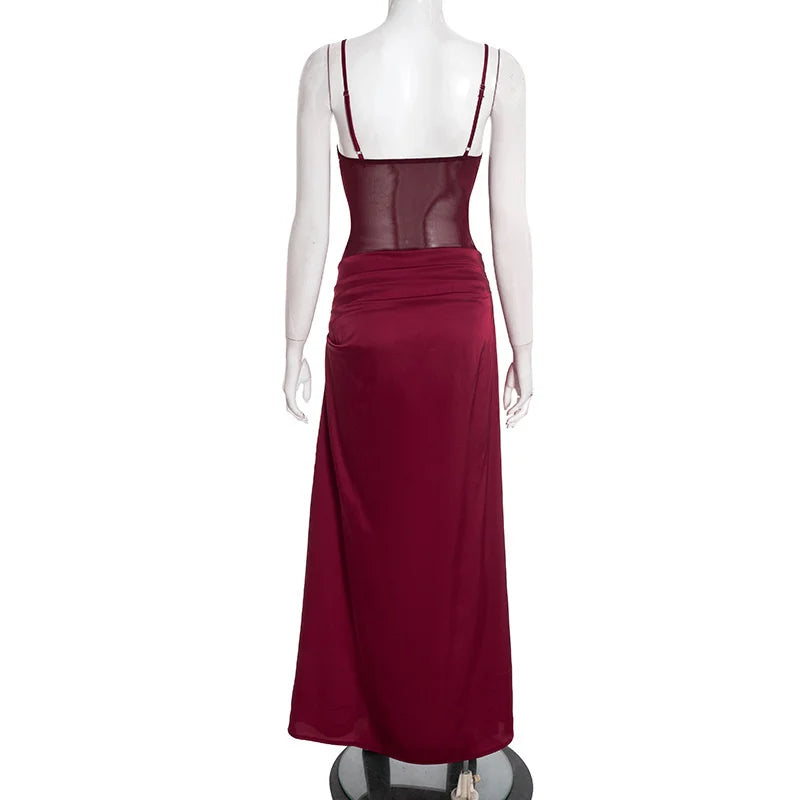 Red evening gown on a mannequin against a white background