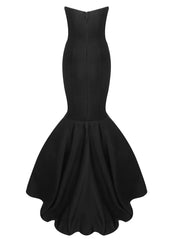 Black evening gown with a fitted bodice and flowing skirt on a white background