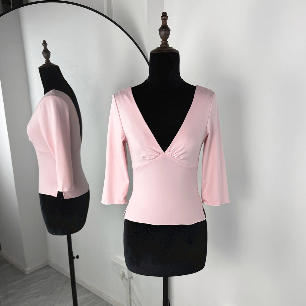 Pink blouse on a mannequin with a white background