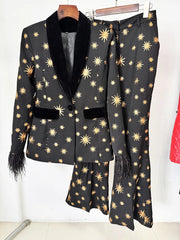 Black star embroidered blazer and flare pants set hanging on a rack.