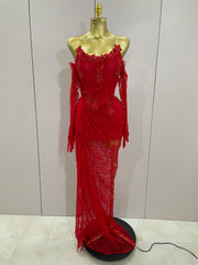 Red lace dress on a mannequin against a plain background