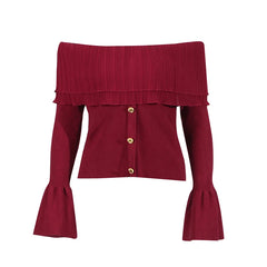 Red off-shoulder top with ruffled details and gold buttons on a white background