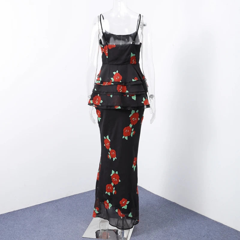 Black floral dress on a mannequin against a white background