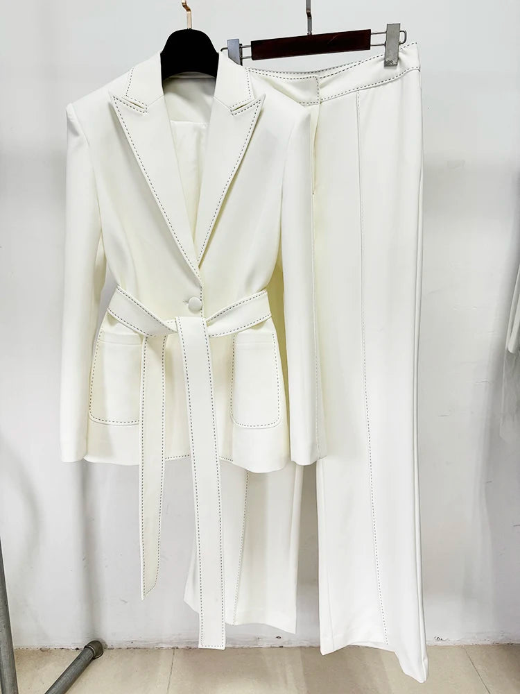 White belted blazer and wide-leg pants suit with contrast stitching, displayed on a hanger, showing the front.