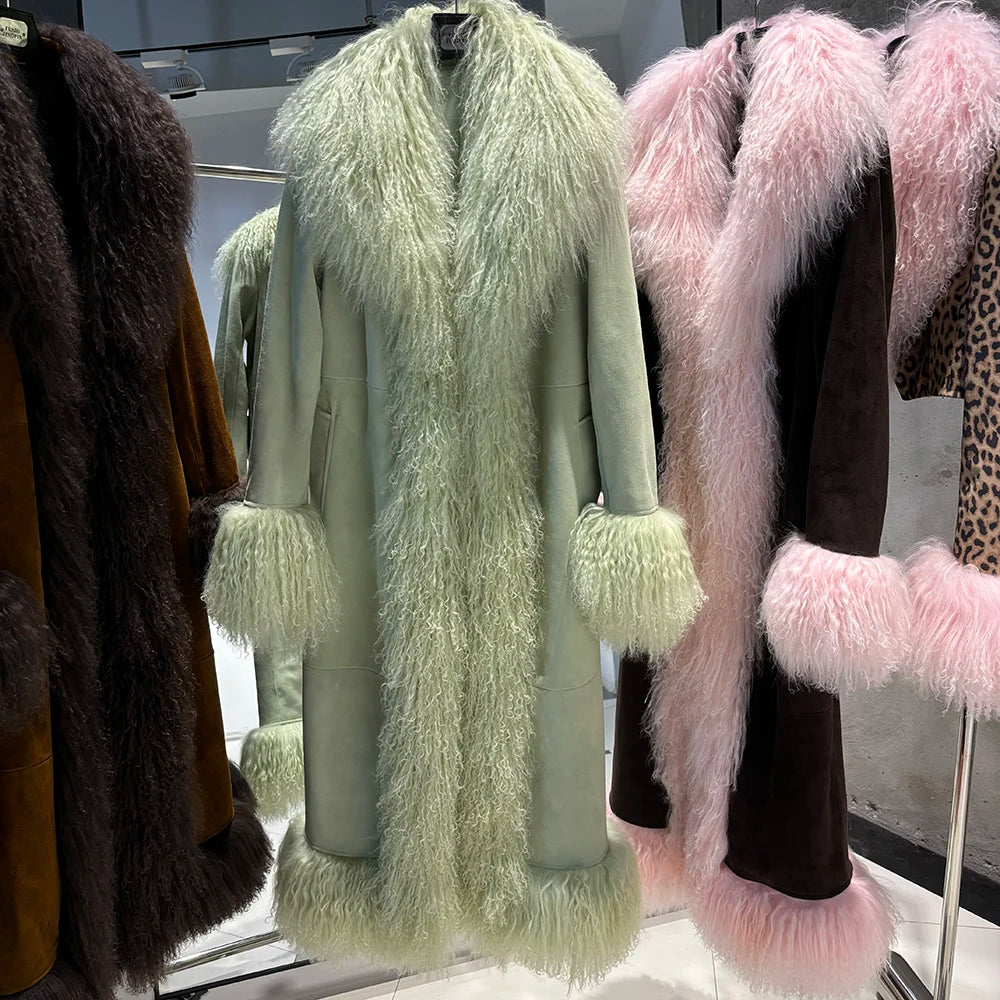 Light green fur coat with fluffy trim on a rack, surrounded by other fur coats.